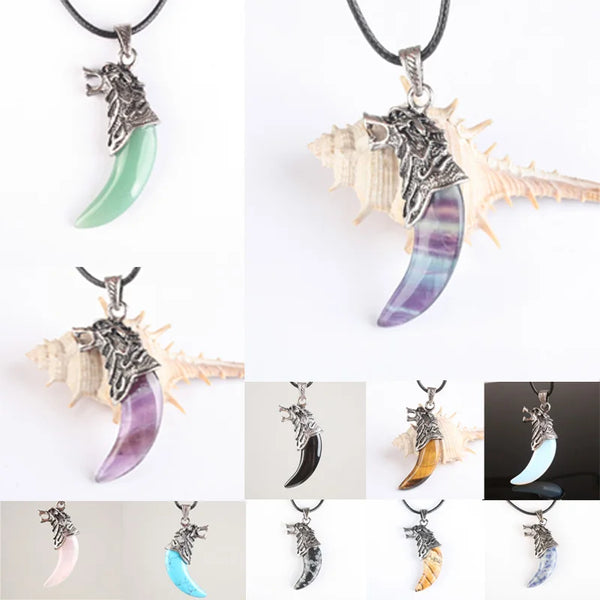 Collage of various crescent moon-shaped pendants with different colored stones and decorative elements.